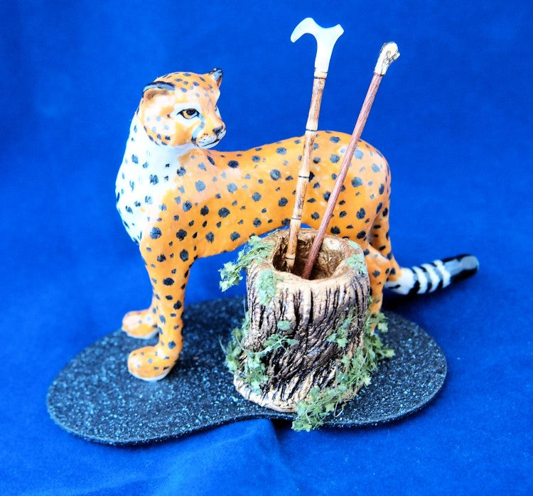 Leopard with the umbrella/cane stand, canes included.
