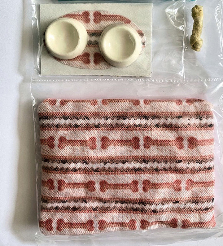 Dog Dishes with a Pink and Black Mat