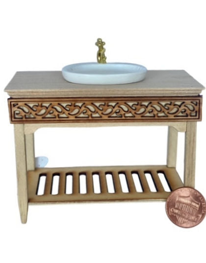 Miniature sink on a unpainted wooden table frame
