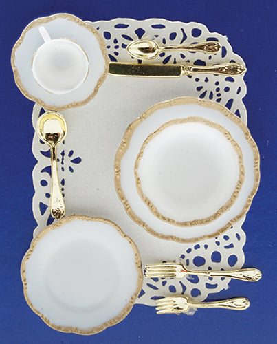 One Miniature Place Setting with a Gold Trim