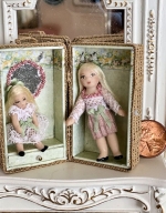 Two Pretty miniature dolls in their own wicker carrying case
