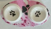 Dog Dishes with a Pink and Black Mat